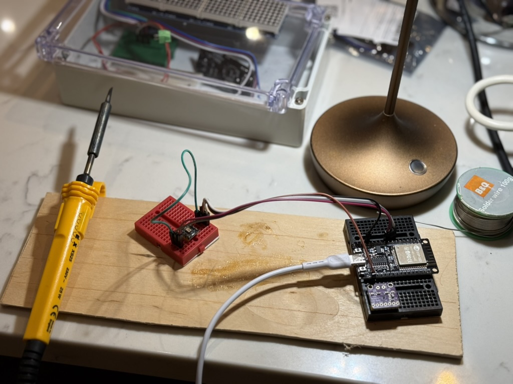 An ESP32 development board and microphone module wired together on breadboards for initial wake-word testing.